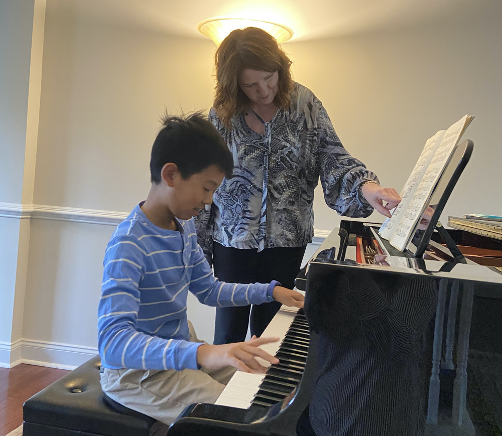 Laurel engaged in a lesson with one of her students at the Laurel Tinney School of Piano serving the Blue Bell, PA area of Montgomery County, PA.